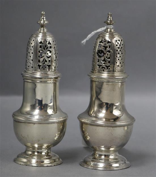 Two similar George II silver pepperettes/casters, Samuel Wood, London, 1742 & 1743, (af),